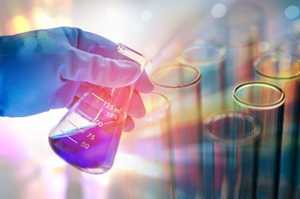 Scientist holding solution in glassware in laboratory with rainbow overlay